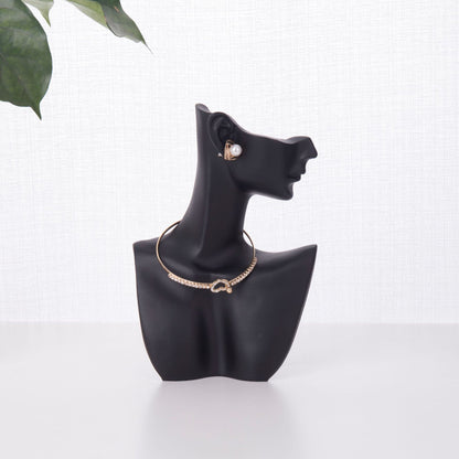 resin jewelry display stand in white storefront