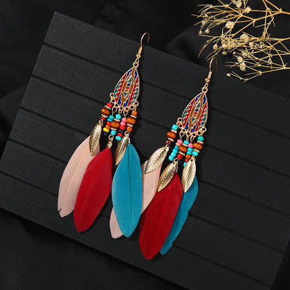 Stylish tassel earrings on model