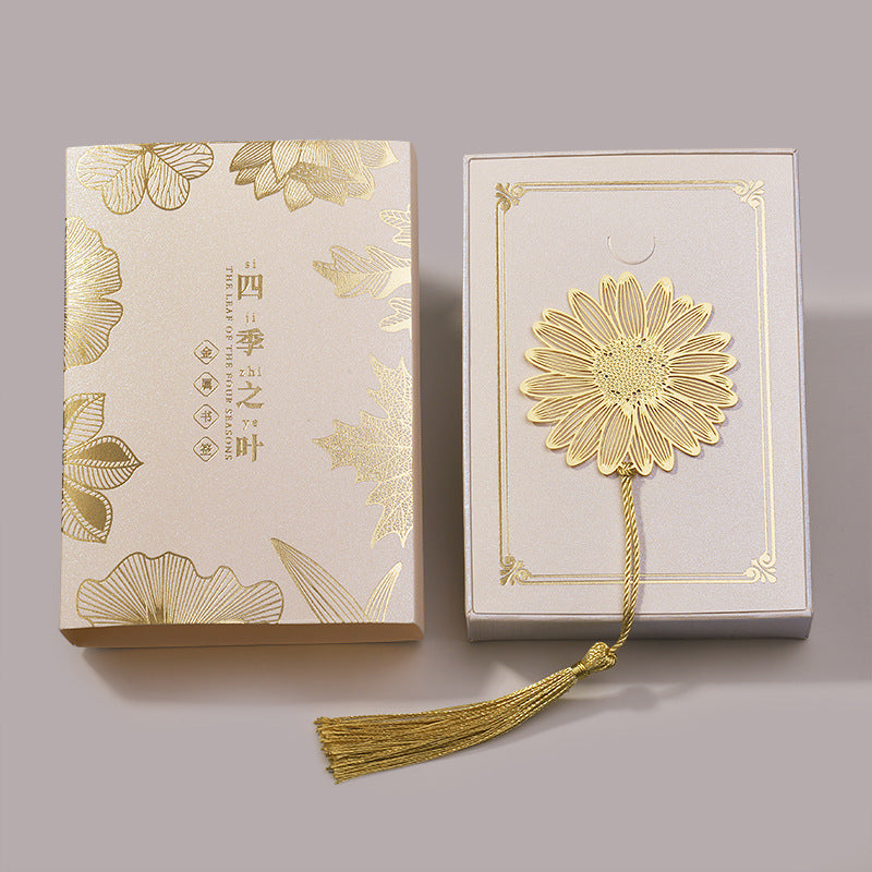 Elegant metal bookmark displayed on an open book