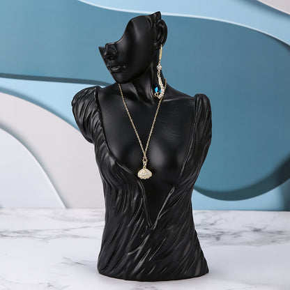 resin jewelry display stand in white storefront