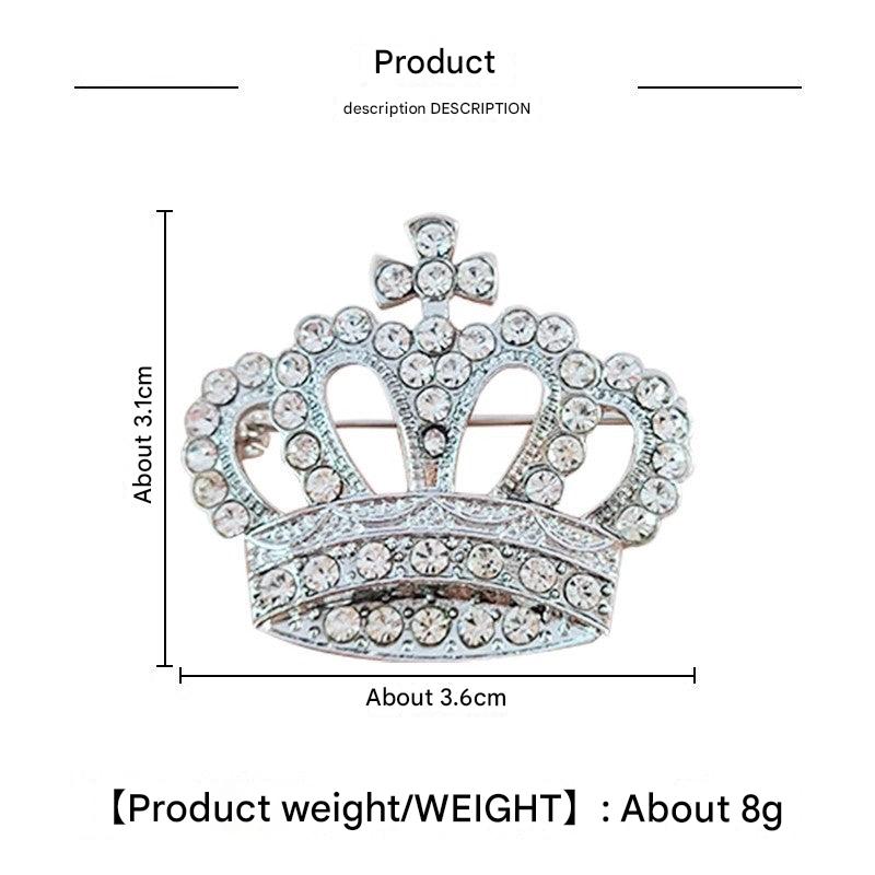 Gold crown brooch with rhinestones